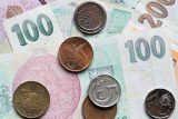 Koruna sílí oproti americkému dolaru. Po čtyřech letech se dostala pod 21 korun